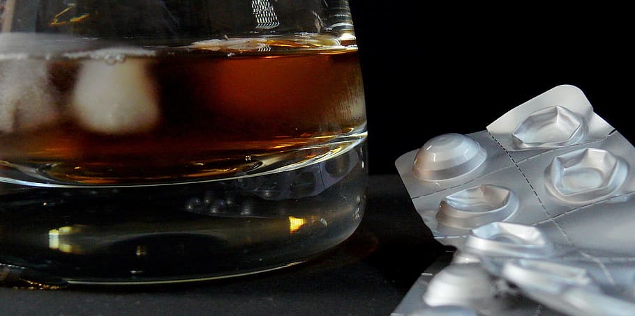 medication blister pack beside rocks glass, bar, cafe, cocktail