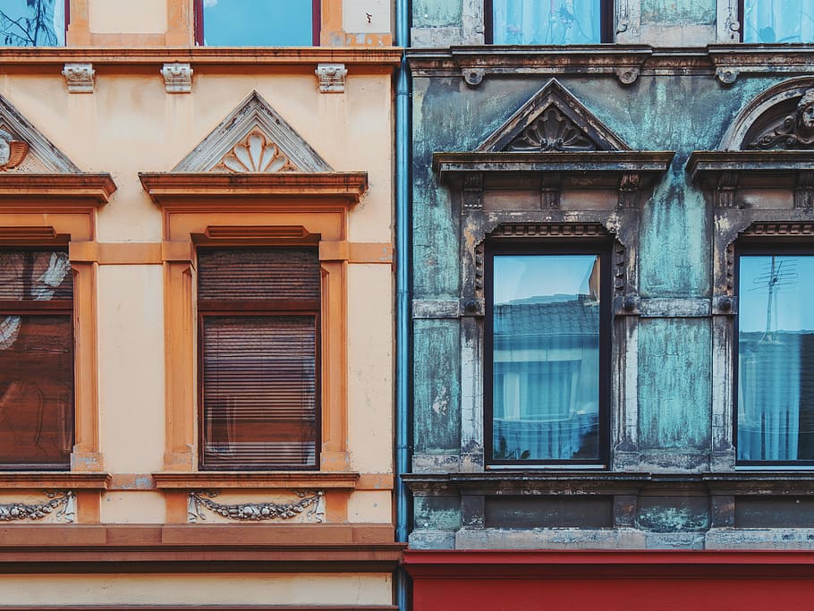 two blue and beige house wall paints photography, two brown and black concrete buildings HD wallpaper