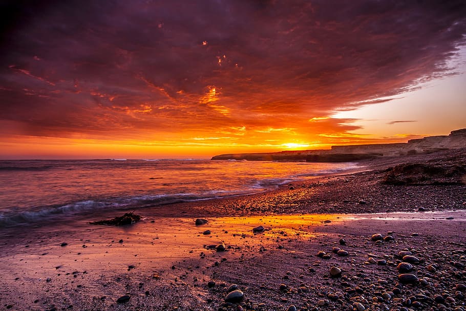 rocks near ocean under sunset, beach, sand, sky, dusk, waves HD wallpaper