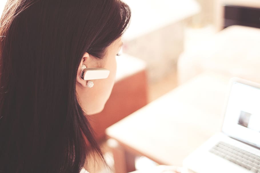 Woman Wearing Earpiece Using White Laptop Computer, access, adult HD wallpaper