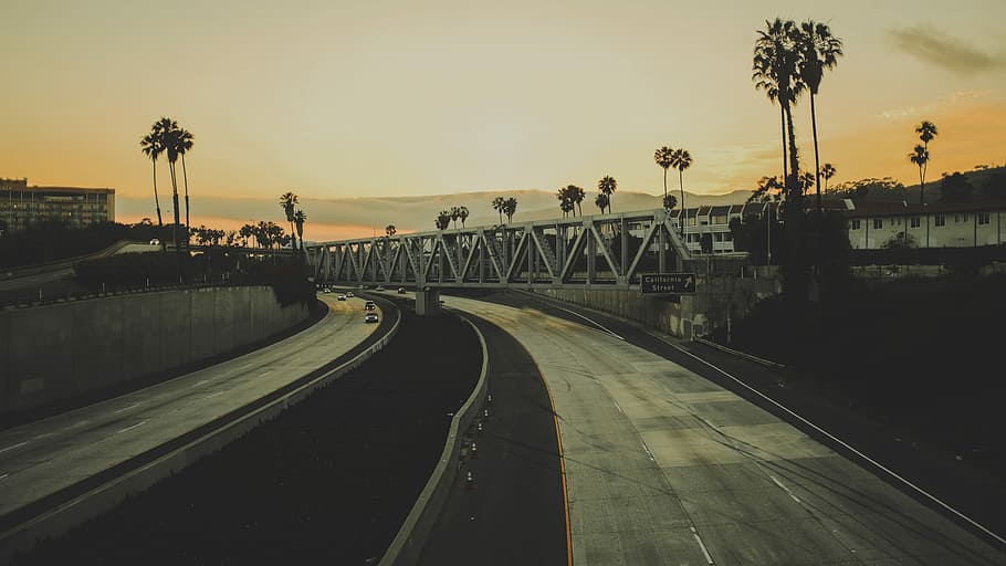 two gray concrete roads under gray truss bridge during sunset, photography of road HD wallpaper