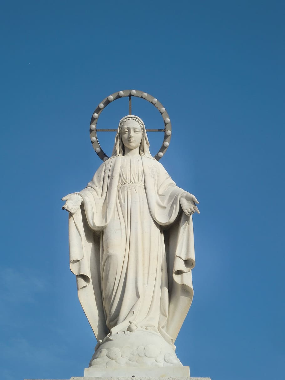 female concrete statue during daytime, maria, white, halo, sky