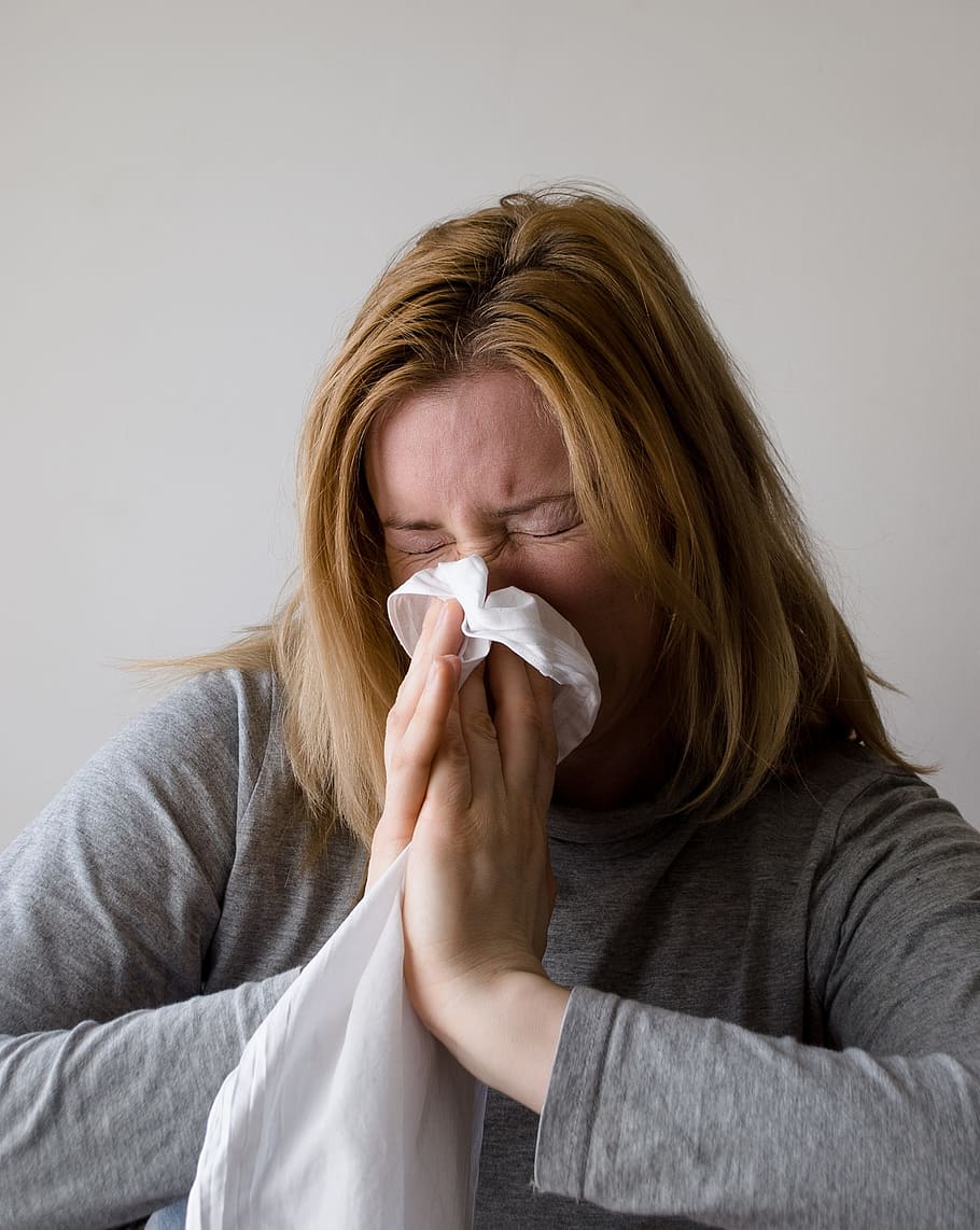 woman sneezing through towel, blow, blowing, nose, hand chief