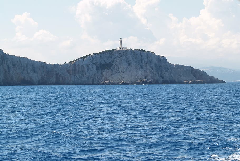 lighthouse, rock, sea, blue, nature, coastline, mountain, water HD wallpaper