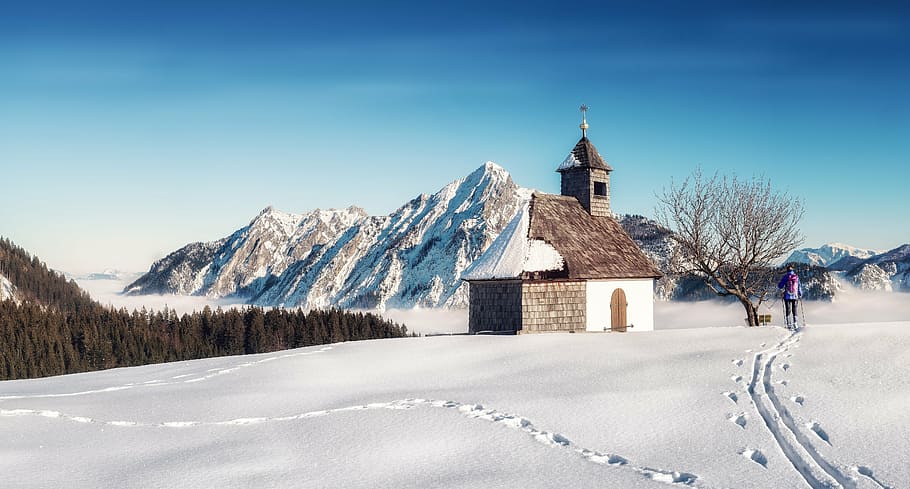 brown concrete house near bare tree during snow, chapel, mountains HD wallpaper