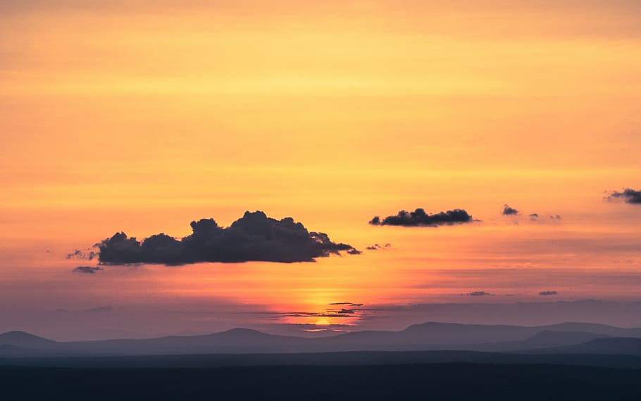 silhouette of mountains during golden hour, dark clouds over mountain HD wallpaper