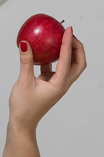 person holding red apple fruit, hand, human body part, human hand HD wallpaper