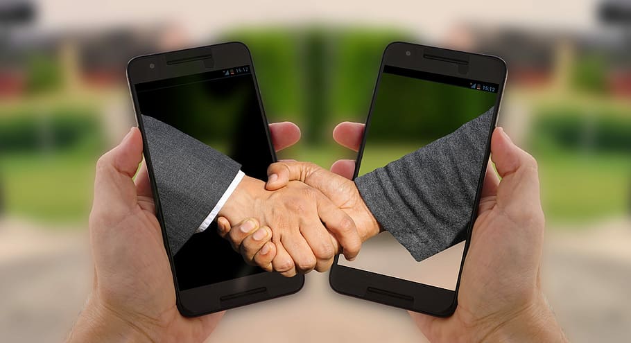 two person shaking hands and two black smartphones, handshake HD wallpaper