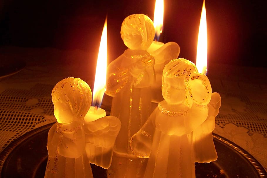macro photography of lighted angel candles, candlestick, glass HD wallpaper