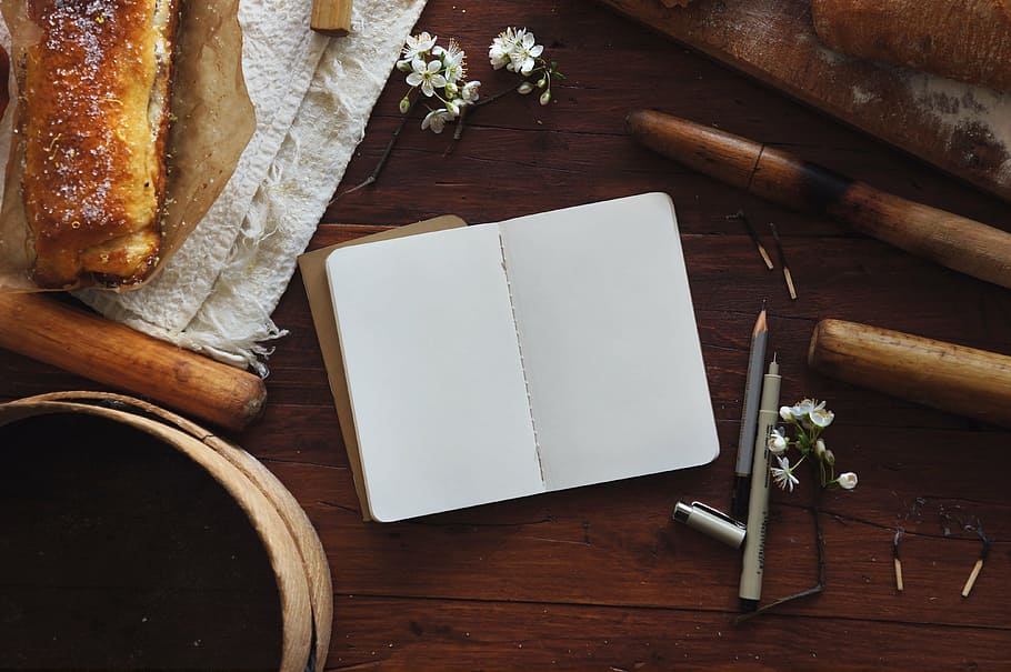 open book page with gray marker pen, bread, flora, flowers HD wallpaper