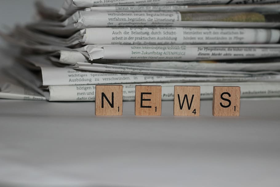 brown NEWS tiles standing in front of grey piled newspapers, newsletter, HD wallpaper