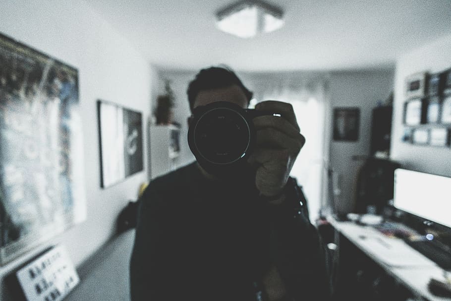 man holding camera inside room, people, office, work, business HD wallpaper