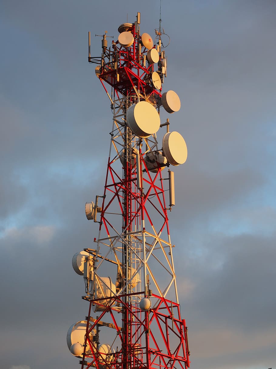 red and white satellite tower, radar equipment, antennas, radio tower