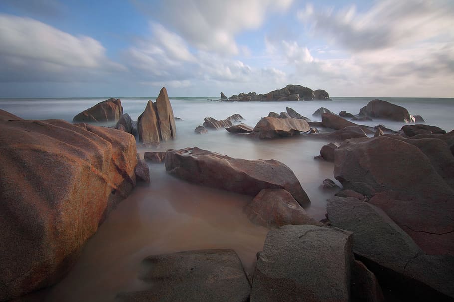Rocks in Sea during Daytime, beach, nature, ocean, sand, seascape HD wallpaper