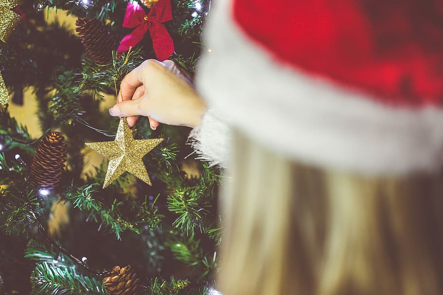 Young Woman Decorating a Christmas Tree, blonde, christmas evening