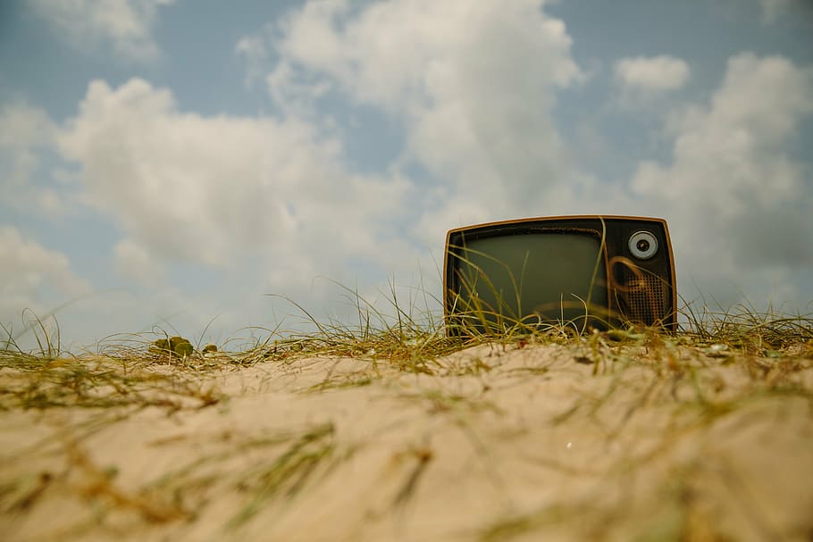 CRT television on brown sand, vintage, tv, oldschool, ground, HD wallpaper