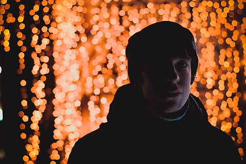 man in winter suit with light background, man wearing black hat in focus photography HD wallpaper
