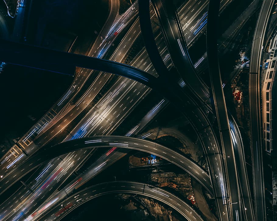 cars traveling, aerial time-lapse photography of vehicles on a multi-level highway crossing HD wallpaper