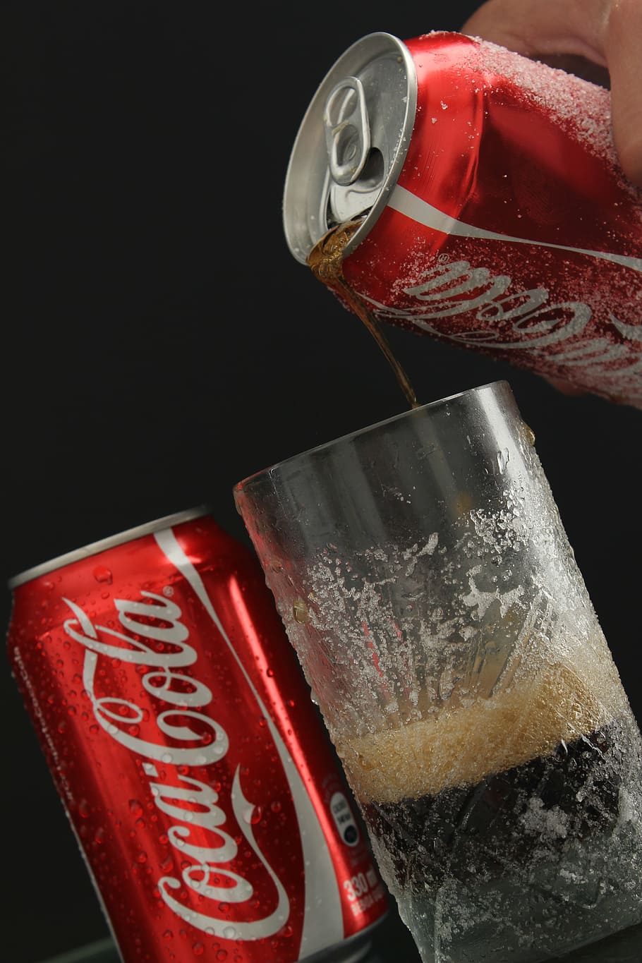 person pouring Coca-Cola soda on highball glass, drink, coca cola