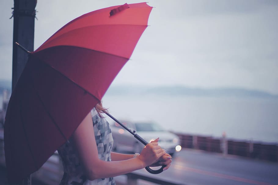 Woman holding red umbrella, outdoors, women, rain, one Person HD wallpaper