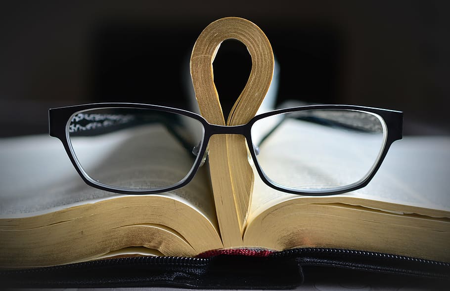eyeglasses with black frames, bible, gilt edge, book, book pages