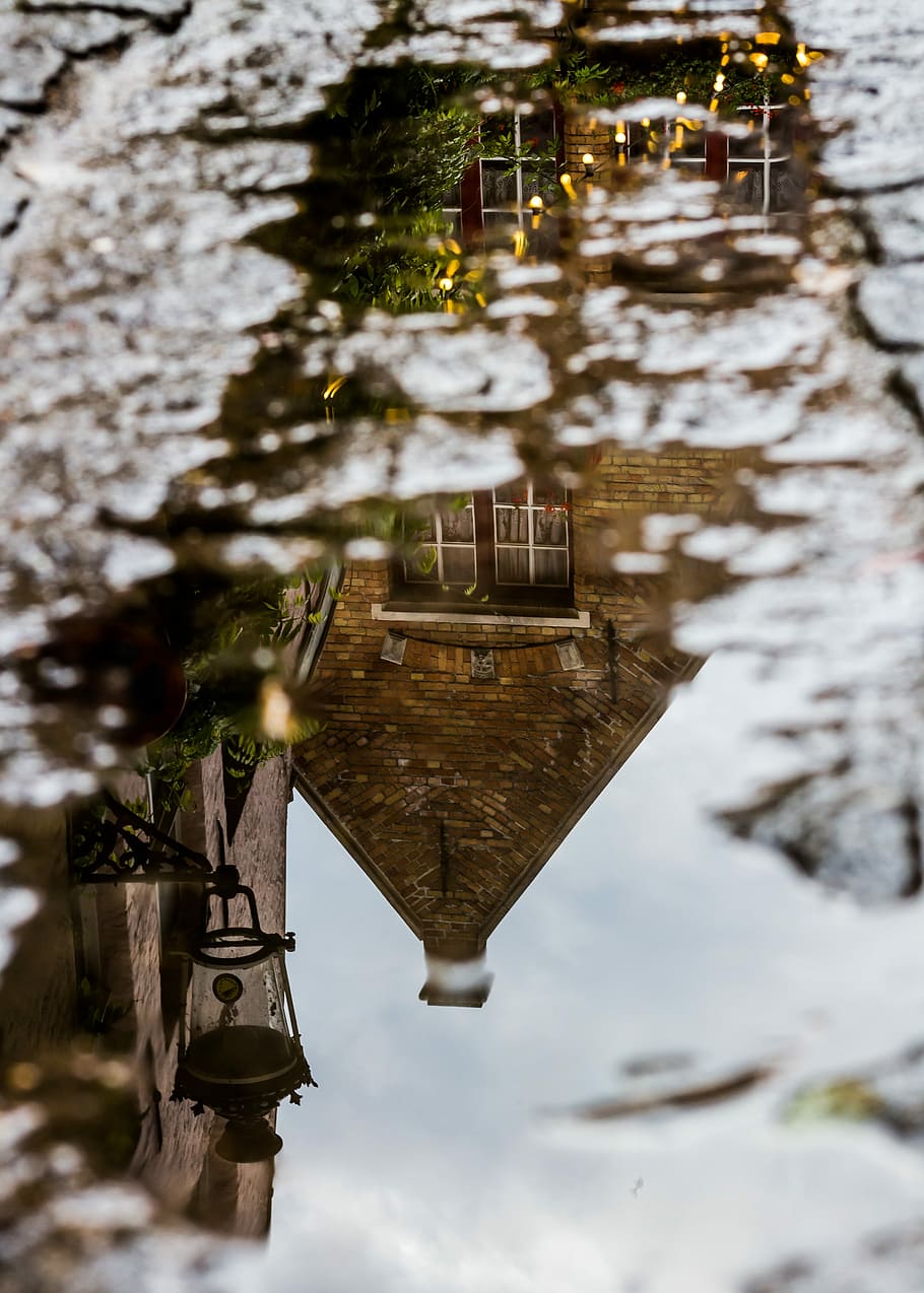 water mirror reflection of concrete house during daytime, reflection of house on body of water during daytime HD wallpaper