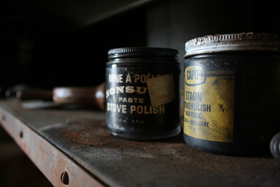 stove polish container on shelf, jars, dusty, old, vintage, antique