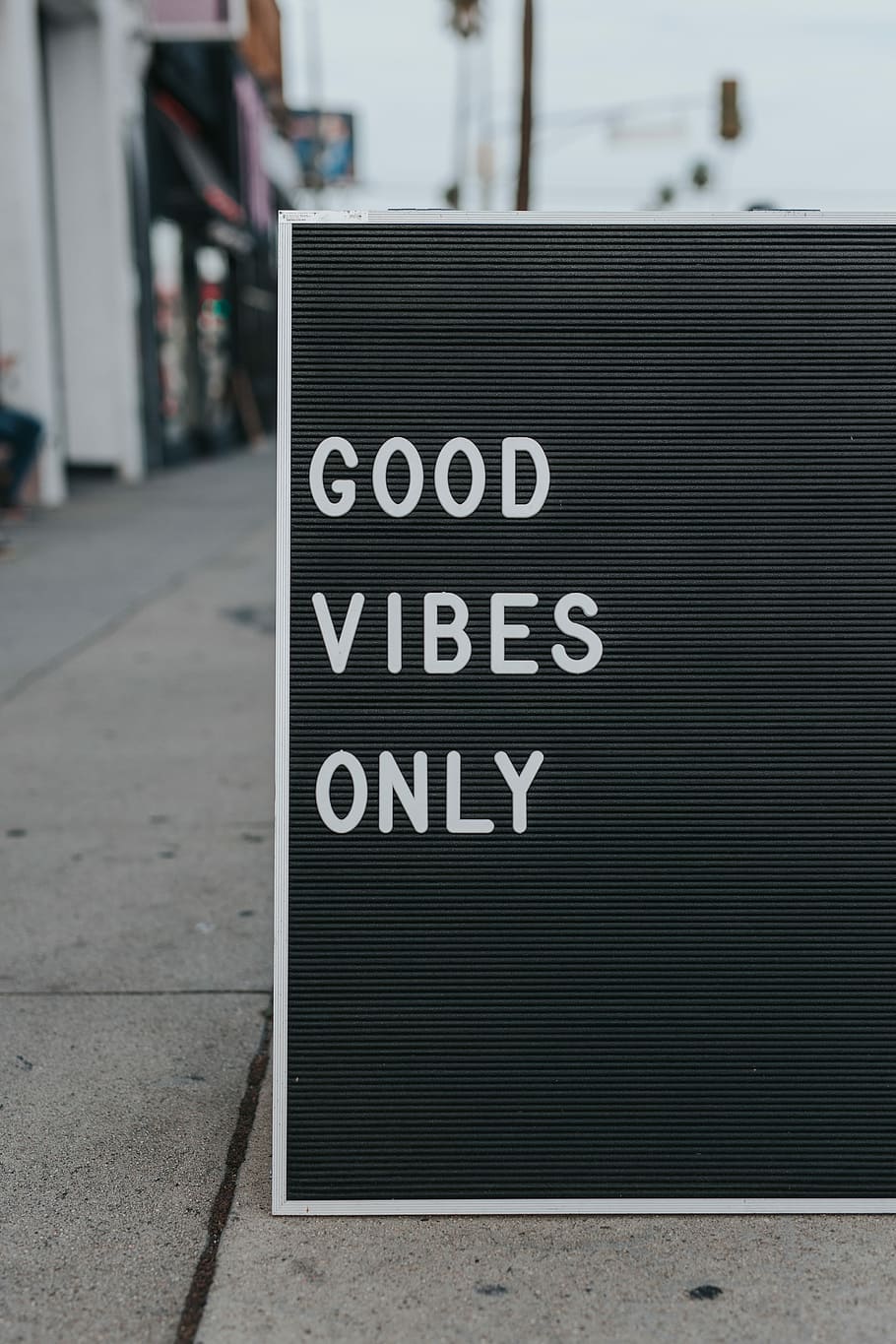 good vibes only text, rectangular gray and white board with good vibes only text ]