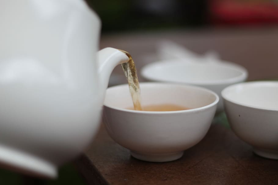 person holding a teapot pouring tea in a teacup, kettle, hot, HD wallpaper