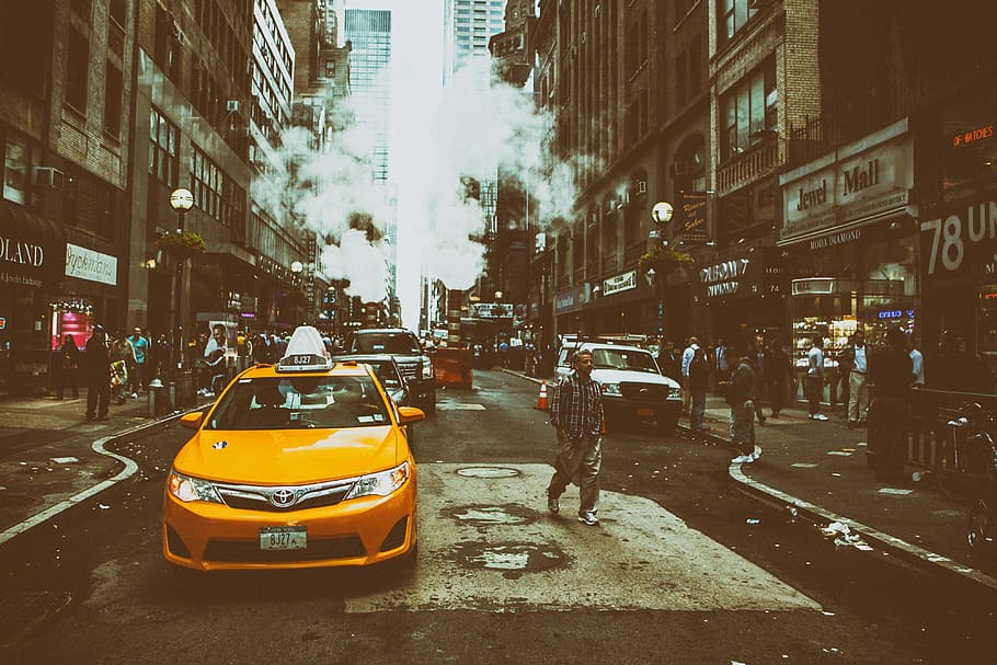 Street shot containing a yellow taxi cab on an overcast day in Midtown Manhattan in New York City, HD wallpaper