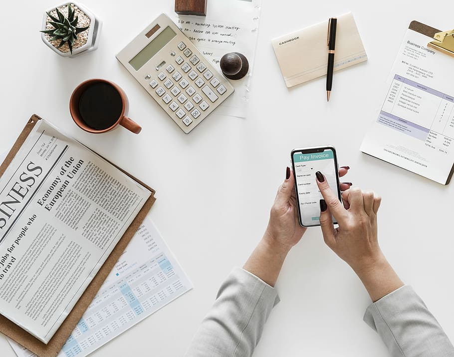 person holding opened silver iPhone X, workspace, working, flatlay HD wallpaper