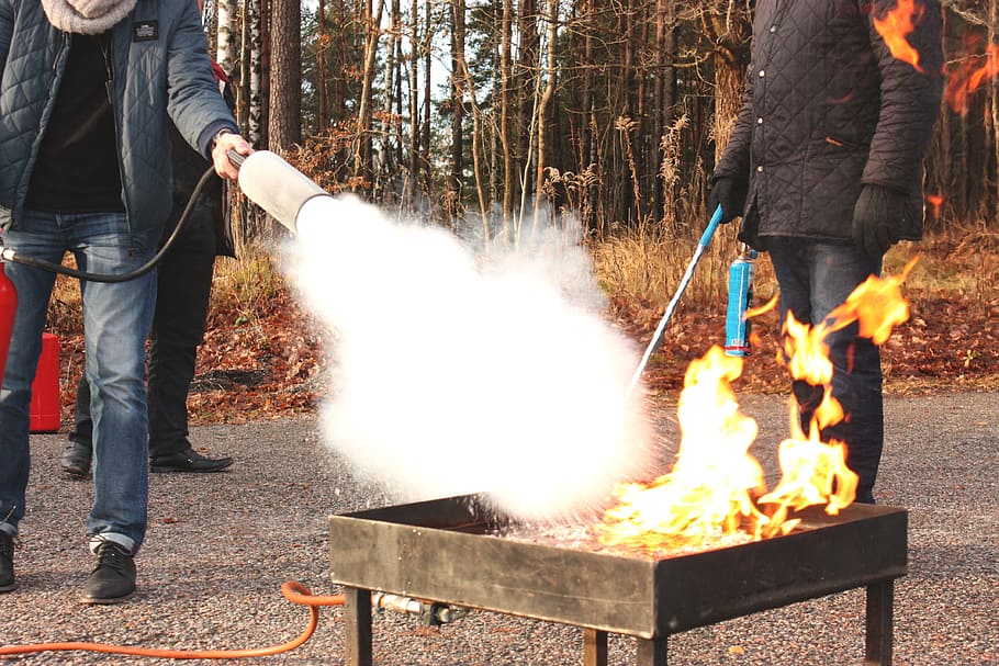 clipart of man using fire extinguisher