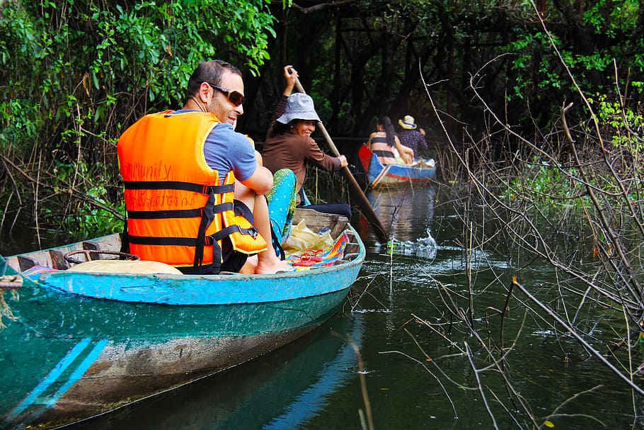 people riding on boat on body of water, floating, forest, floating forest HD wallpaper