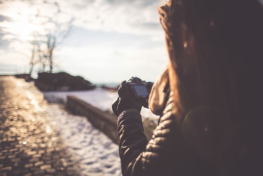 Girl Taking Photographs with her DSLR, camera, cold, photographer