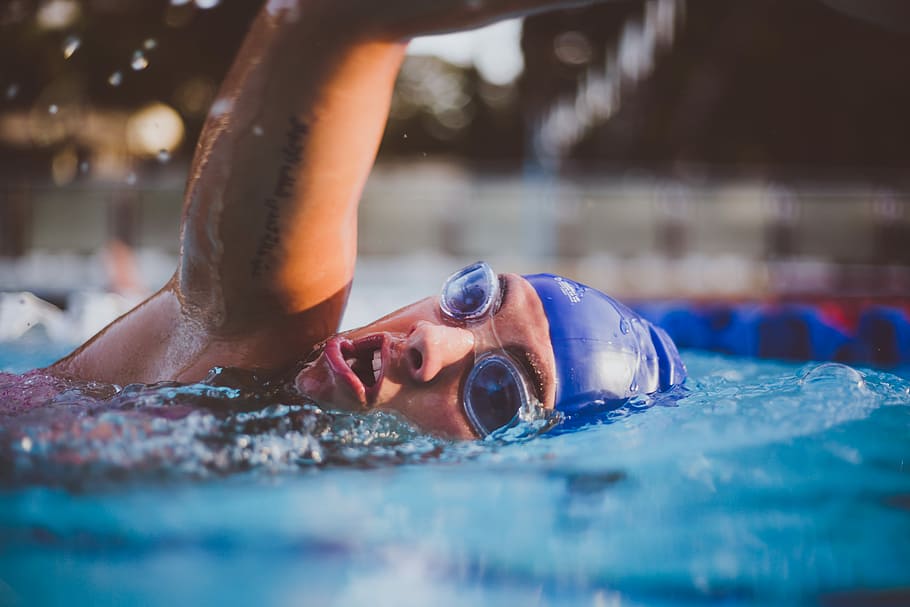 person swimming on blue pool, swimmer, splash, goggles, swimming hat, HD wallpaper