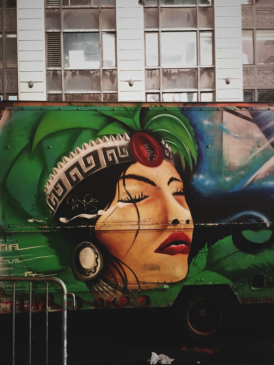 truck with graffiti near gray building, woman wearing tree head dress truck art HD wallpaper