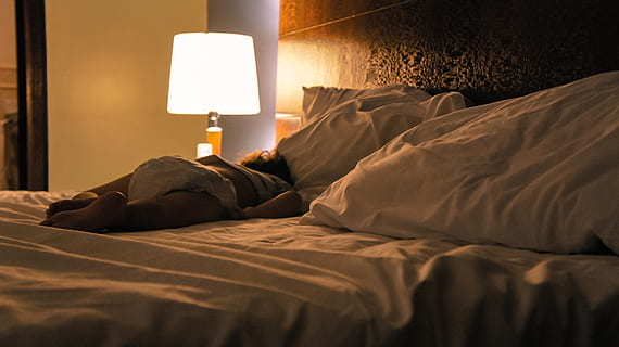 baby lying on bed beside turned on table lamp, child, light HD wallpaper