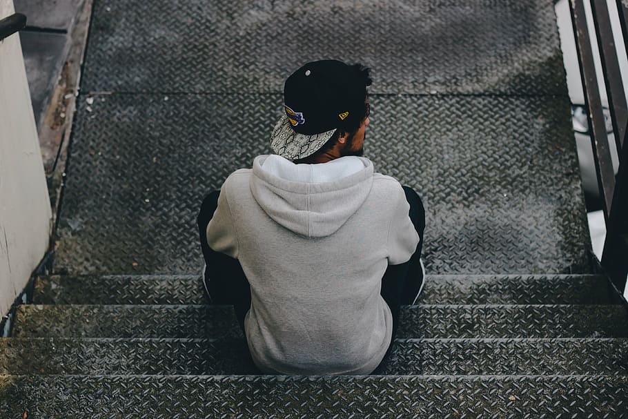 man sitting on gray staircase, cap, model, person, stairs, walkway HD wallpaper