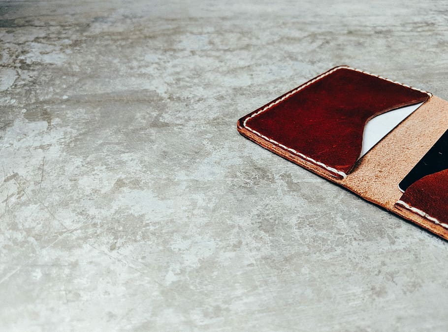brown leather flip case, brown leather textile on gray surface HD wallpaper