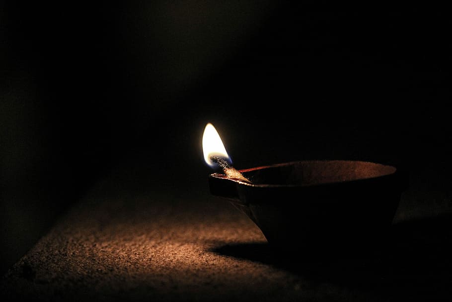 Absence of Darkness, brown candle on brown holder, match, flame HD wallpaper
