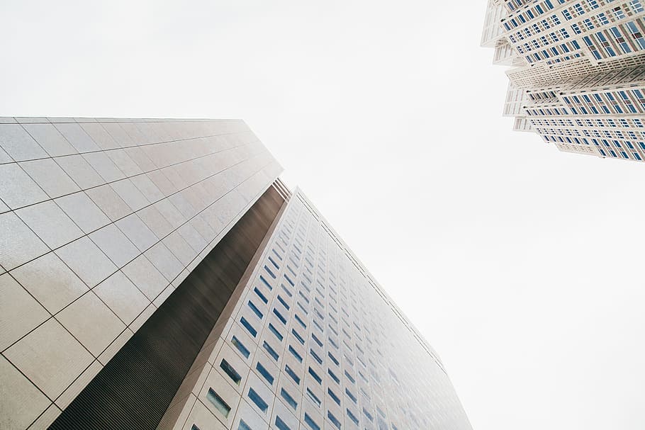architectural photography of white building, bottom view of concrete building HD wallpaper
