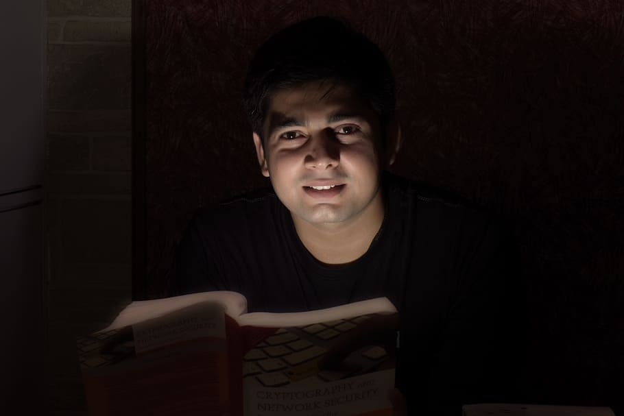 man wearing black shirt reading a book, books, computer, coding HD wallpaper