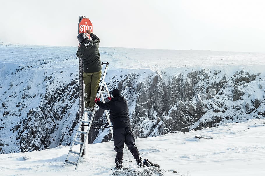 person holding a ladder, mountains, warning, danger, a stop sign HD wallpaper