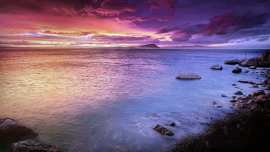 body of water near seashore during purple and orange sky, beach HD wallpaper