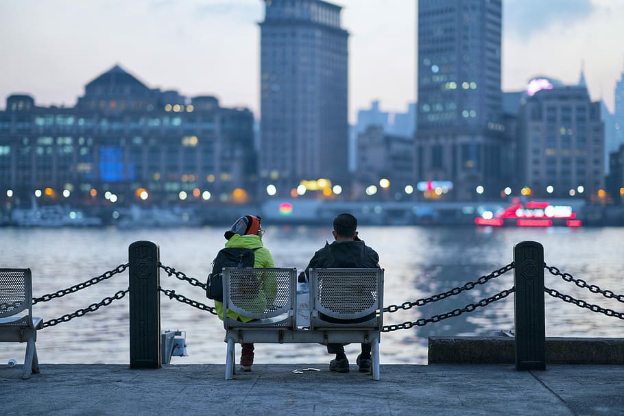 man and woman sitting on bench, seats, two, pair, architecture HD wallpaper