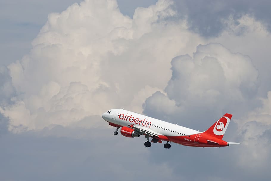 whtie and red Airberlin airplane flying midair under white clouds at daytime HD wallpaper