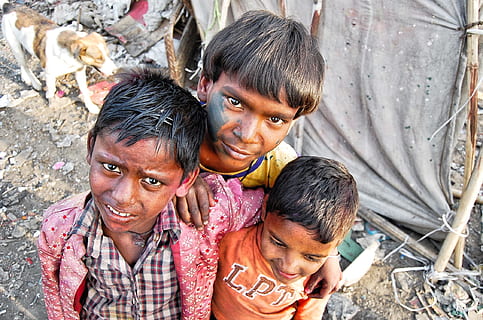 three boys standing close to each other, poor, slums, india HD wallpaper