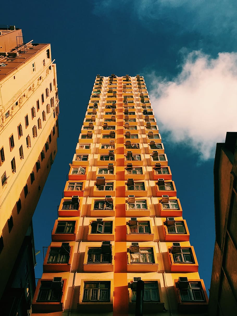 architectural photo of high-rise building, low-angle photography of orange high rise building HD wallpaper
