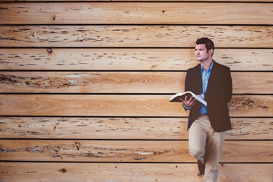 man in brown suit jacket leaning on brown wall, people, alone HD wallpaper