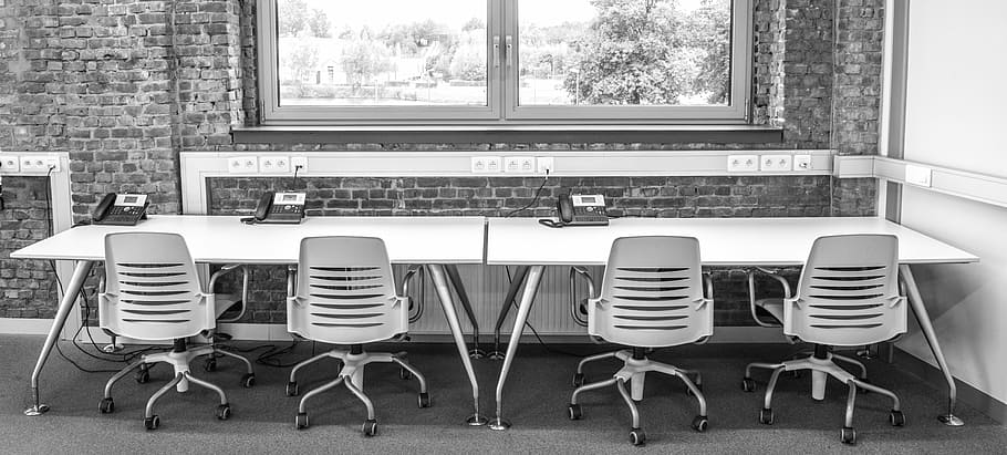vacant four white rolling armchairs in front of rectangular white wooden table near clear glass window HD wallpaper